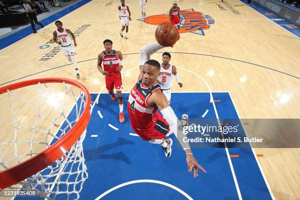 Russell Westbrook of the Washington Wizards dunks the ball against the New York Knicks on March 25, 2021 at Madison Square Garden in New York City,...