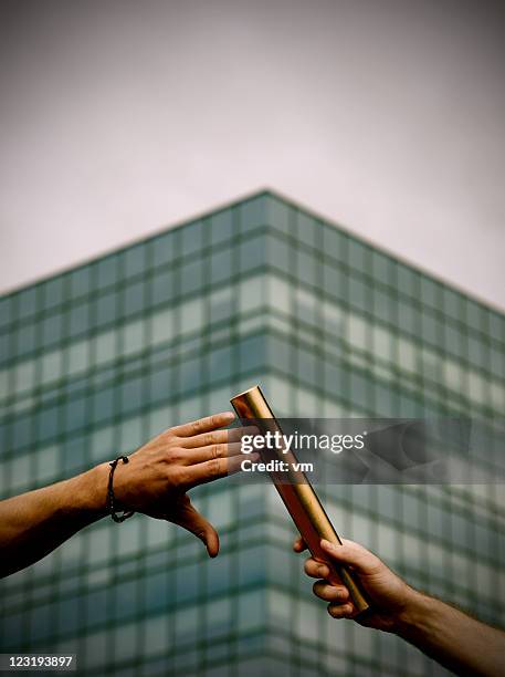 passing the relay baton - stafettpinne bildbanksfoton och bilder