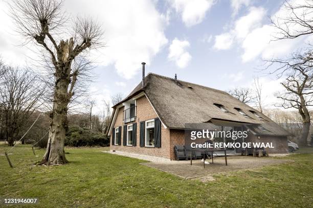 Woman cleans and arranges a holiday home owned by Staatsbosbeheer in Apeldoorn on March 26, 2021. - Dutch nationals are booking more holidays within...