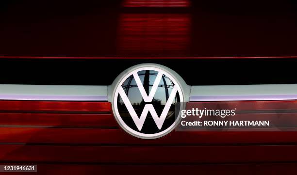 The VW logo is on display at the headquarters of German carmaker Volkswagen in Wolfsburg, northern Germany, on March 26, 2021. - German auto giant...