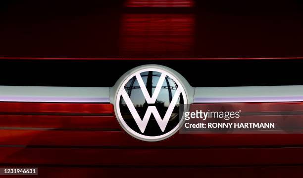 The VW logo is on display at the headquarters of German carmaker Volkswagen in Wolfsburg, northern Germany, on March 26, 2021. - German auto giant...