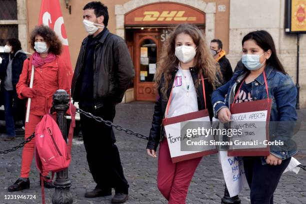Children with placards ask to go back to school protest in front of Montecitorio for the reopening of schools and against distance learning during a...