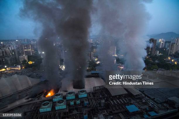 Plumes of smoke rising after a major fire broke out at Dreams Mall, Bhandup on March 26, 2021 in Mumbai, India. 11 people died in a major fire broke...