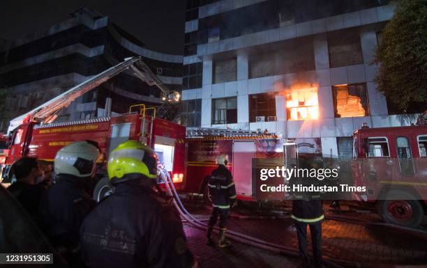 Fire services personnel carrying out dousing operations after a major fire broke out at Dreams Mall, Bhandup on March 26, 2021 in Mumbai, India. 11...