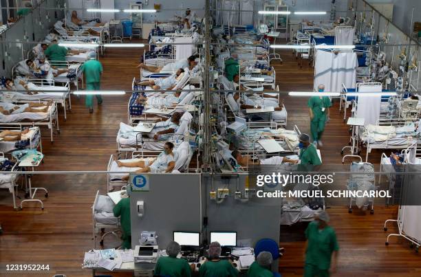 Patients affected by the COVID-19 coronavirus remain at a field hospital set up at a sports gym, in Santo Andre, Sao Paulo state, Brazil, on March...