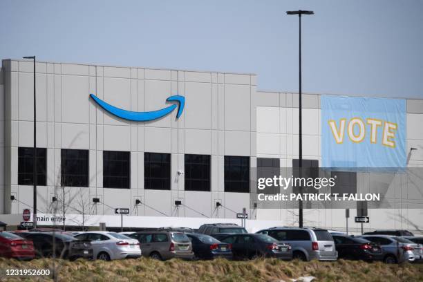 Vote signage hangs outside the Amazon.com, Inc. Fulfillment center in Bessemer, Alabama on March 26, 2021. - Senator Bernie Sanders joined the drive...
