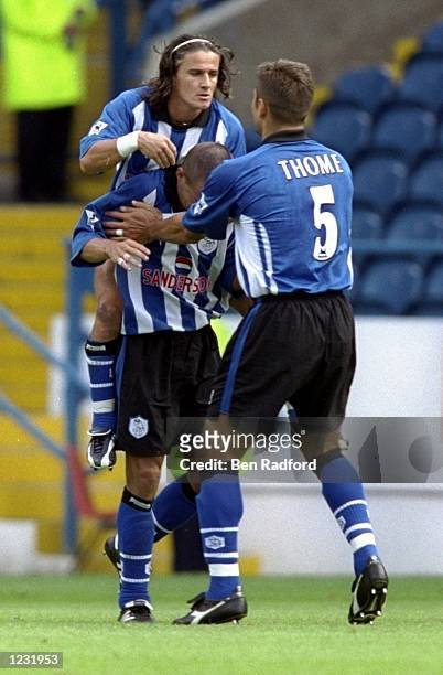 Sheffield Wednesday celebrate Benito Carbone's goal against Tottenham Hotspur during the FA Carling Premiership match at Hillsborough in Sheffield,...