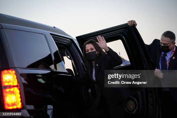 Vice President Kamala Harris waves as she enters her motorcade upon arrival at Joint Base Andrews on March 26, 2021 in Joint Base Andrews, Maryland....