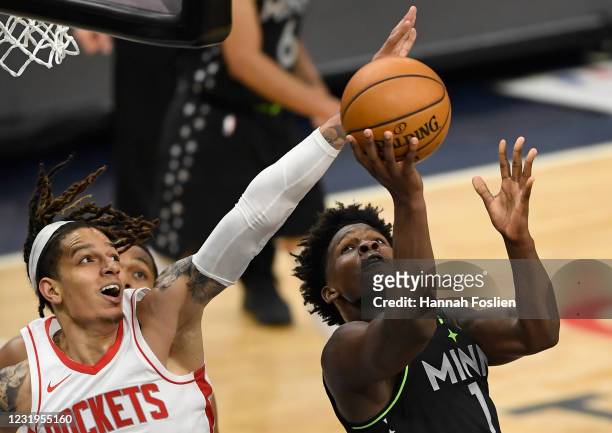 Wilson of the Houston Rockets defends against Anthony Edwards of the Minnesota Timberwolves during the fourth quarter of the game at Target Center on...