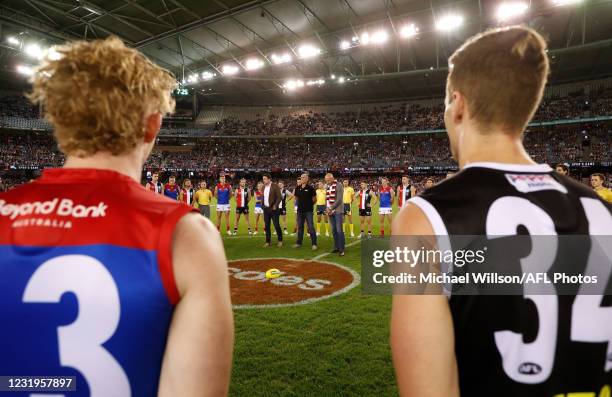 Garry Lyon, Tony Lockett and Stewart Loewe address players and the crowd in honour of Danny Frawley during the 2021 AFL Round 02 match between the St...