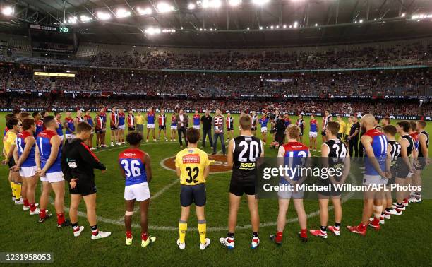 Garry Lyon, Tony Lockett and Stewart Loewe address players and the crowd in honour of Danny Frawley during the 2021 AFL Round 02 match between the St...