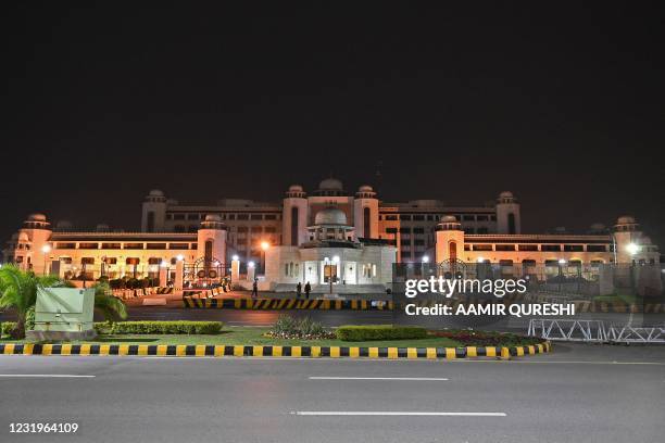 General view of the illuminated Pakistan's Prime Minister office building is pictured before the Earth Hour in Islamabad on March 27, 2021.