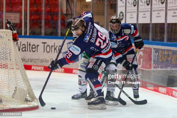 Ryan O'Connor of Iserlohn Roosters, Jens Baxmann of Iserlohn Roosters and Drew LeBlanc of Augsburger Panther battle for the puck during the DEL match...