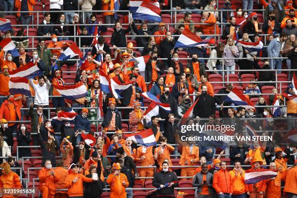 Dutch fans, who were tested for Covid-19 earlier in the day and tested negative, gather is a section of the stadium during the World Cup qualifying...