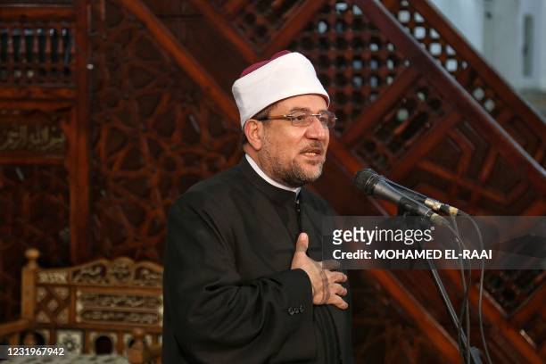 Egypt's Minister for Endowments and Religious Affairs Mohamed Mokhtar Gomaa speaks during a symbolic funerary service at the Sayyida Nafissa mosque...