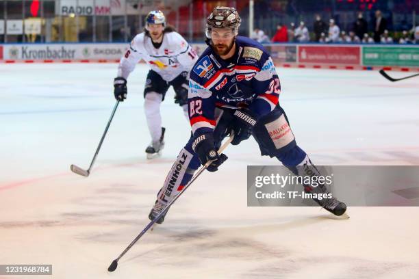 Alexandre Grenier of Iserlohn Roosters controls the puck during the DEL match between Iserlohn Roosters and EHC Red Bull München on March 23, 2021 in...