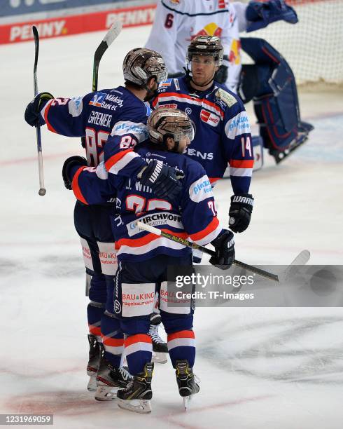 Alexandre Grenier of Iserlohn Roosters celebrates after scoring his teams first goal with teammates during the DEL match between Iserlohn Roosters...
