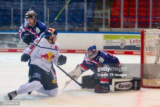 Maximilian Daubner of EHC Red Bull Muenchen and Andreas Jenike of Iserlohn Roosters with a chance to score during the DEL match between Iserlohn...