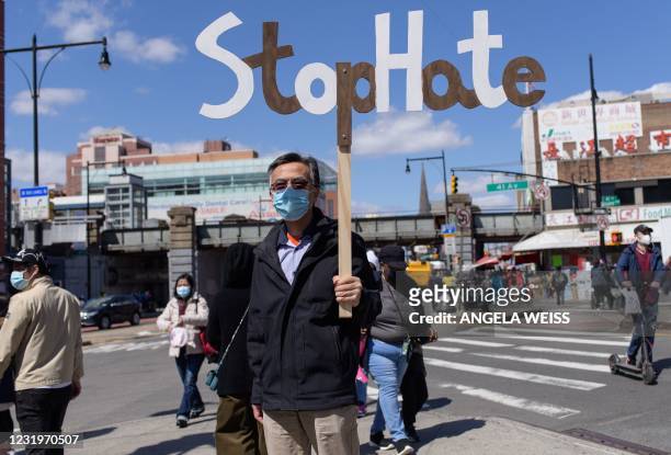 Members and supporters of the Asian-American community take part on the nationwide day of protests against anti-Asian violence in the Queens borough...