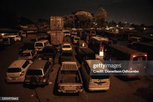 Buses and Cars are seen parked minutes after the 8 pm curfew began on March 27 in Nairobi, Kenya. Most residents from Nairobi were required to return...