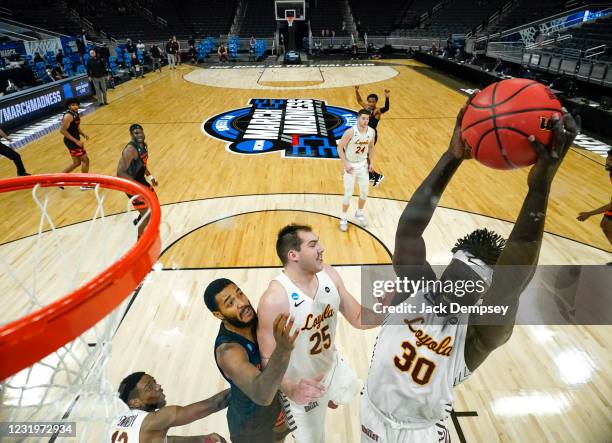 Her Uguak of the Loyola Ramblers grabs a rebound against the Oregon State Beavers in the Sweet Sixteen round of the 2021 NCAA Division I Mens...