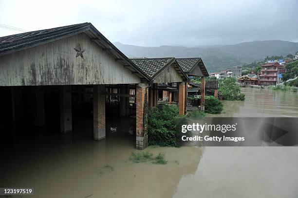Village is surrounded by flood waters as the typhoon Nanmadol arrives in Fujian on August 31, 2011 in Fuzhou, Fujian Province of China. Nanmadol, the...