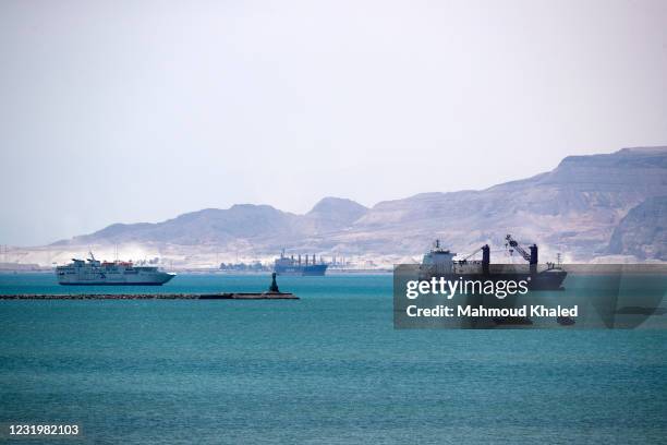 Ships and boats are seen at the entrance of Suez Canal on March 28, 2021 in Suez, Egypt. Work continues to free the Ever Given, a huge container ship...