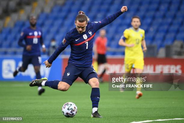 France's forward Antoine Griezmann kicks the ball during the FIFA World Cup Qatar 2022 qualification Group D football match between Kazakhstan and...