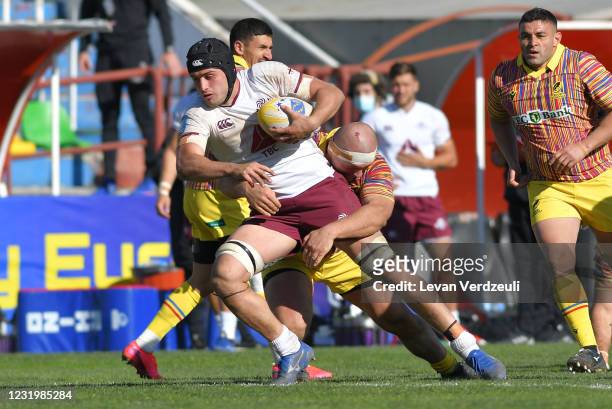 Tornike Jalagonia of Georgia is tackled during the Rugby Europe International Championship round 4 match between Georgia and Romania at Mikheil...