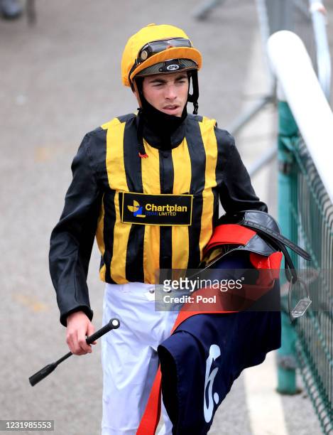 Jockey James Doyle makes his way back after competing in the Unibet Novice Stakes at Doncaster Racecourse, on March 28, 2021 in Doncaster, England.