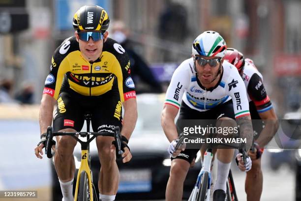 Belgian Wout Van Aert of Team Jumbo-Visma sprints to win over Italian Giacomo Nizzolo of Qhubeka Assos a at the finish of the Gent-Wevelgem - In...