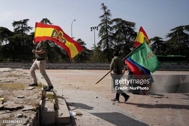 Spanish pre-constitutional flag waves in the air during a gathering of right-wing supporters at Arco de la Victoria commemorating the 82nd...