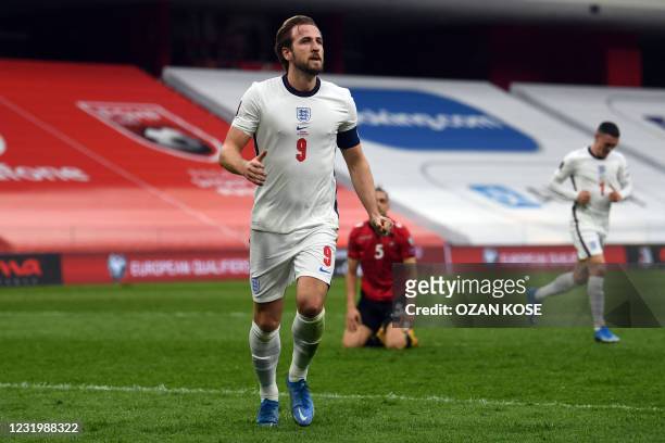 England's forward Harry Kane celebrates after scoring a goal during the FIFA World Cup Qatar 2022 qualification Group I football match between...