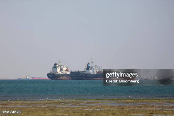 The 'Energy Chancellor' crude oil tanker rides anchor while waiting to enter the Suez Canal in Suez, Egypt, on Sunday, March 28, 2021. A new attempt...