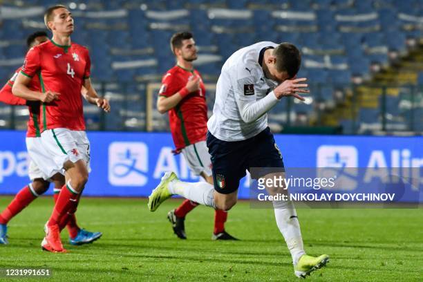 Italy's forward Andrea Belotti celebrates after scoring on a penalty kick during the FIFA World Cup Qatar 2022 qualification Group C football match...