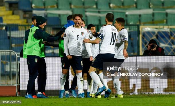 Italy's midfielder Manuel Locatelli celebrates scoring his team's second goal during the FIFA World Cup Qatar 2022 qualification football match...