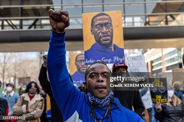 Cortez Rice Local Black Lives Matter activist Cortez Rice raises his fist as ...