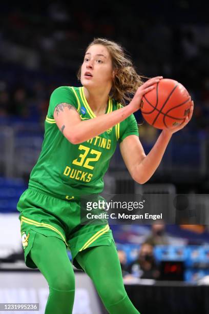 Sedona Prince of the Oregon Ducks looks to pass the ball against the Louisville Cardinals during the third quarter in the Sweet Sixteen Round of the...
