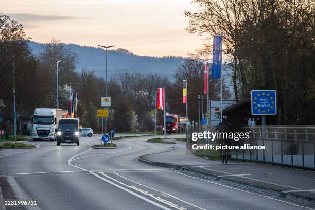 March 2021, Baden-Wuerttemberg, Breisach: A commuter rides his bicycle across the Rhine bridge near Breisach into Germany. France has been declared a...