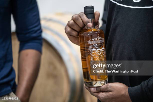 Chris Yarbrough holds a bottle of Brough Brothers bourbon whiskey at Brough Brothers Distillery in Louisville, Kentucky on March 22, 2021. Brough...