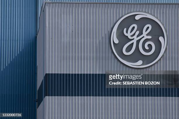 The logo of US giant General Electric is pictured on the Belfort plant, eastern France, on March 29, 2021.