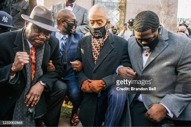 Attorney Ben Crump , Rev. Al Sharpton and the family of George Floyd kneel for 8:46 seconds during a news conference on March 29, 2021 in...