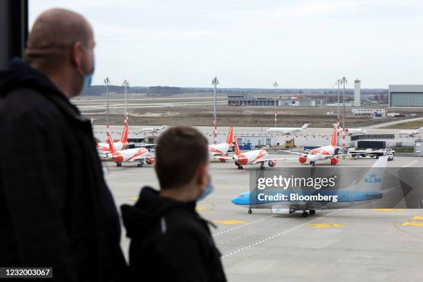 Passenger aircraft, operated by Air France-KLM, passes easyJet Plc aircraft on the tarmac at Berlin Brandenburg Airport in Berlin, Germany, on...