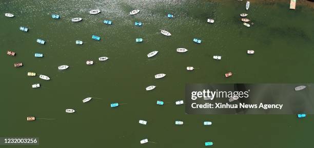 March 28, 2021 -- Aerial photo taken on March 28, 2021 shows empty boats during lockdown in Bhopal, India. India's COVID-19 tally reached 11 624 on...