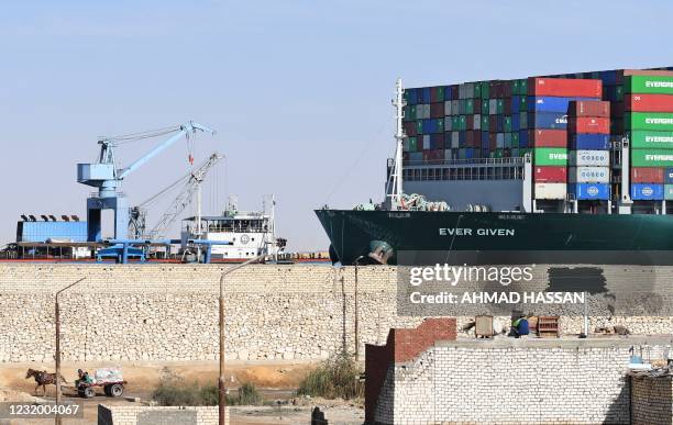 Picture taken on March 29, 2021 shows the Panama-flagged MV 'Ever Given' container ship after being fully dislodged from the banks of the Suez Canal,...