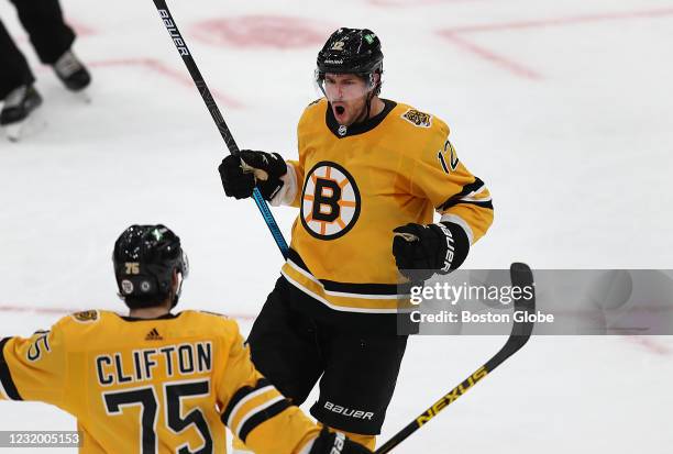 Boston Bruins right wing Craig Smith celebrates his 3rd period goal with Boston Bruins defenseman Connor Clifton putting the Bruins ahead, 3-2. The...