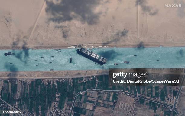 Maxar new high-resolution satellite imagery of the Suez canal and the container ship and tugboats that have the ship nearly unstuck north of the city...