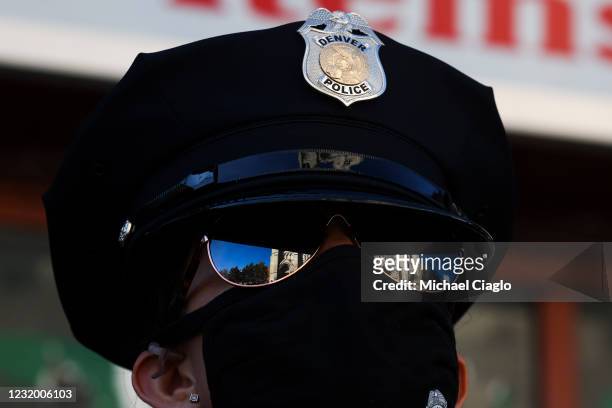 Denver Police officer Lynnea Vento looks up at the Cathedral Basilica of the Immaculate Conception as a funeral mass for slain Boulder Police officer...