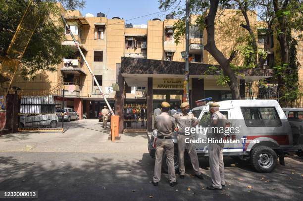 Delhi police personnel seen at Tulip Apartments where Kuldeep Maan alias Fajjaa, a notorious criminal who fled from GTB Hospital on March 25, was...