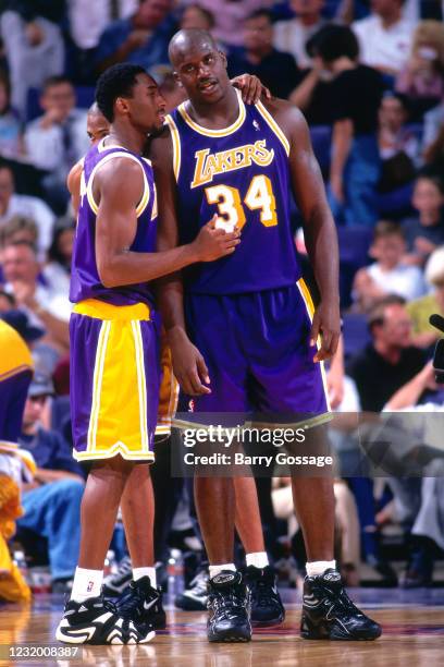 Kobe Bryant and Shaquille O'Neal of the Los Angeles Lakers huddle against the Phoenix Suns during the game at US Airways Center on November 10 1997...